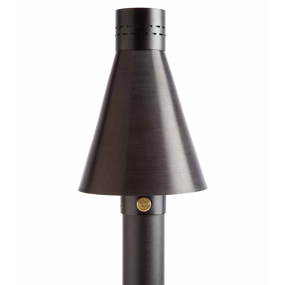 Outdoor gas torch with metallic hammered cone and black pole, unlit