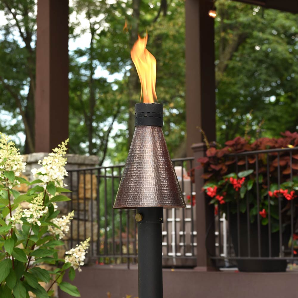 Fire torch head with tall flame, hammered copper body, and black base cap