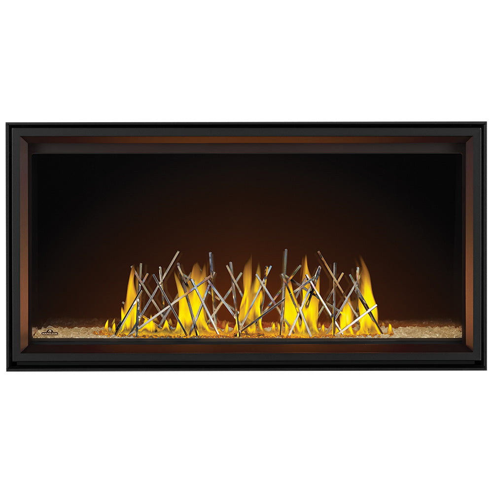 Linear direct vent gas fireplace insert with black trim and glowing log-style flames