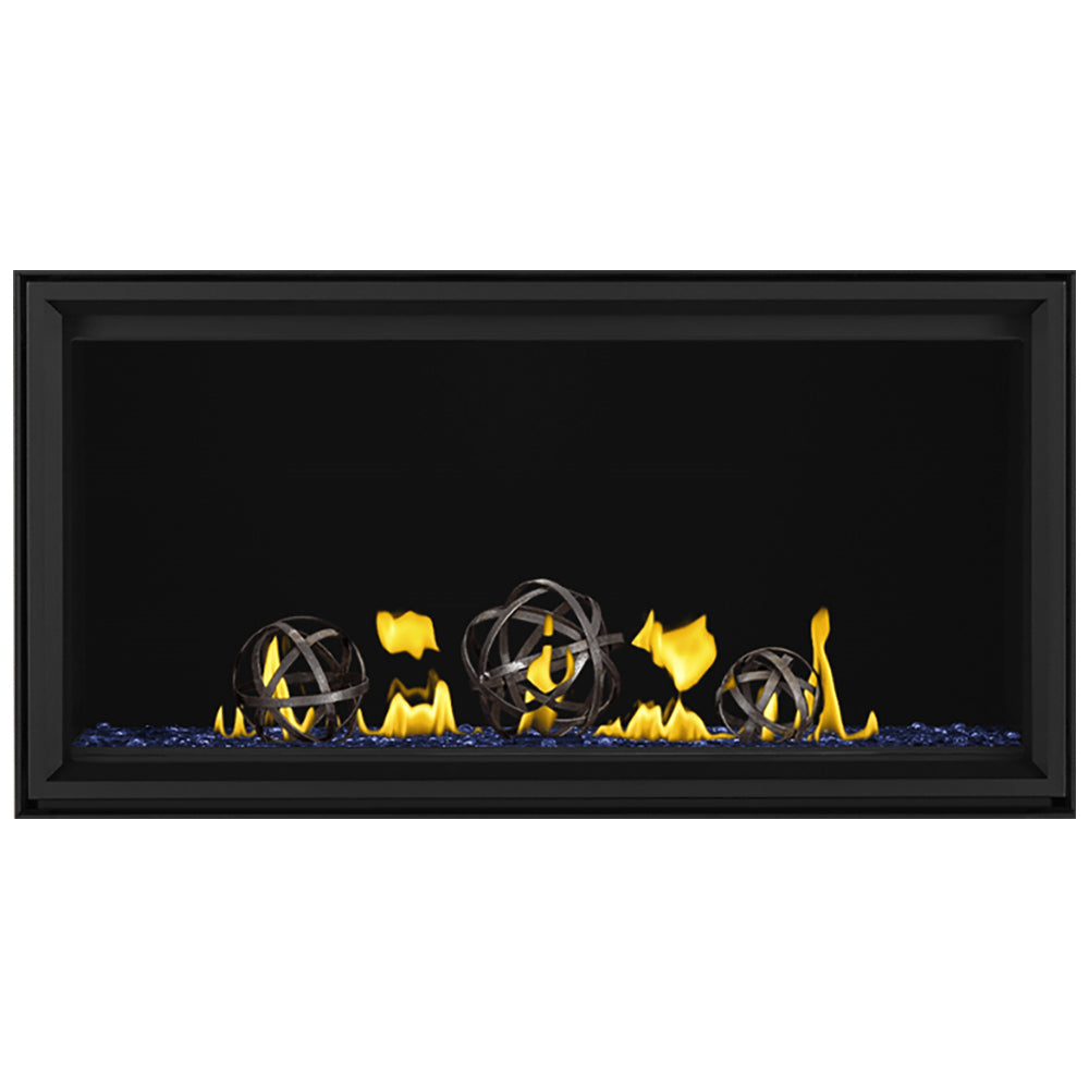 Linear gas fireplace with black frame, yellow flames and iron globes over blue embers
