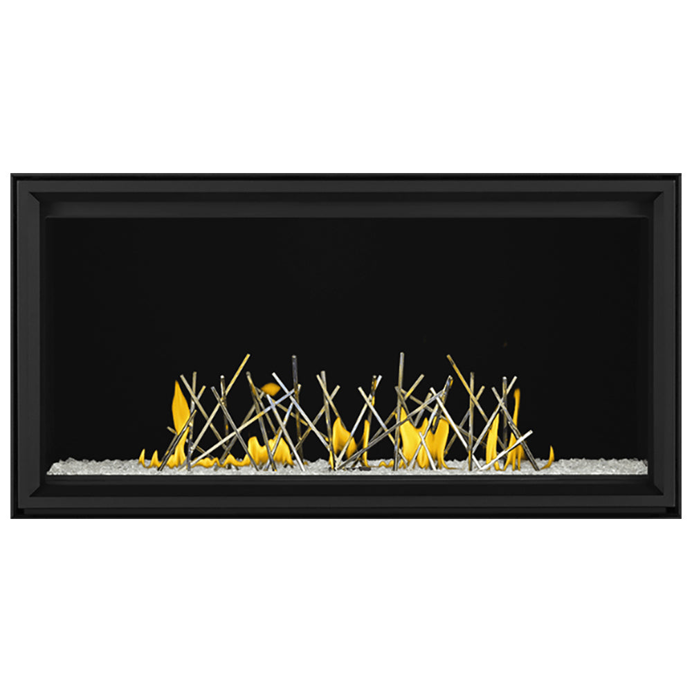 Black linear direct vent gas fireplace with thin branches and yellow flames over ember bed