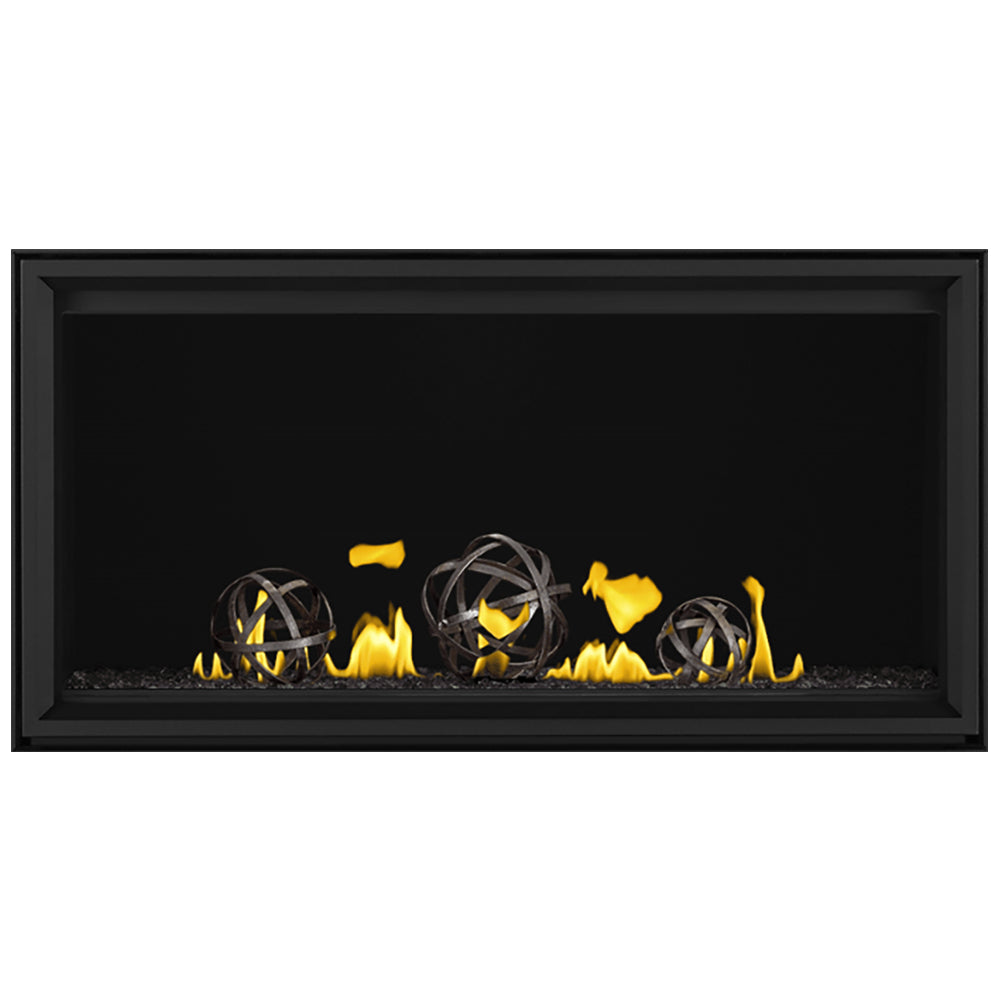 Black linear direct vent gas fireplace with four round burner flames and glowing embers