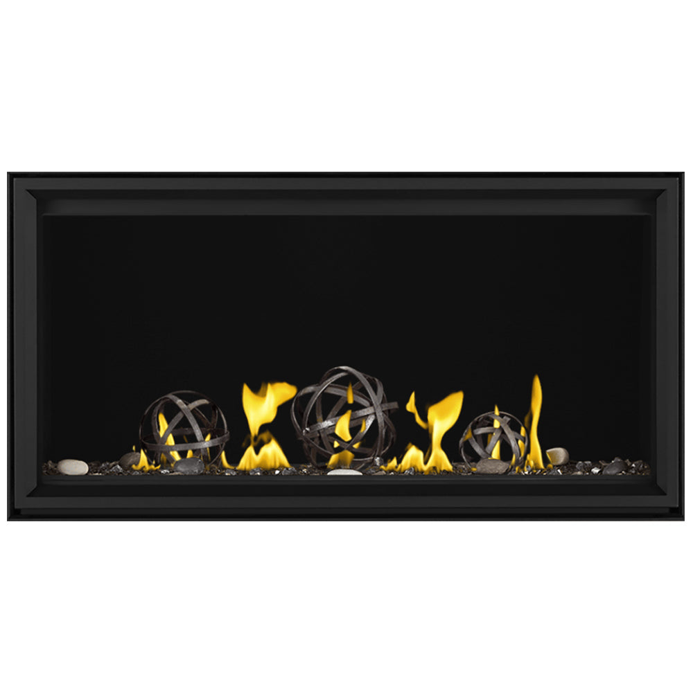 Linear direct vent gas fireplace with yellow flames and wrought-iron globe accents