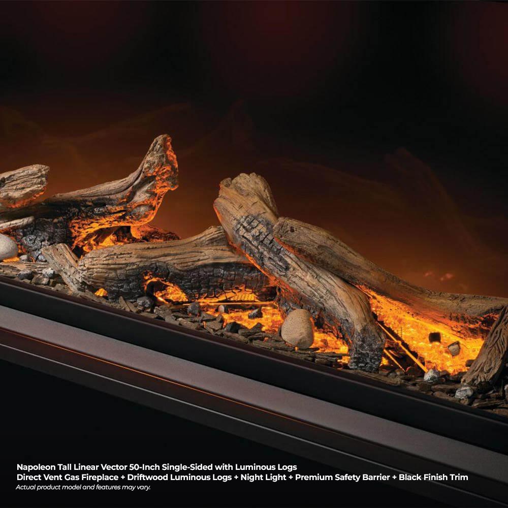 Close-up of luminous logs with embers and orange flames in a linear burner