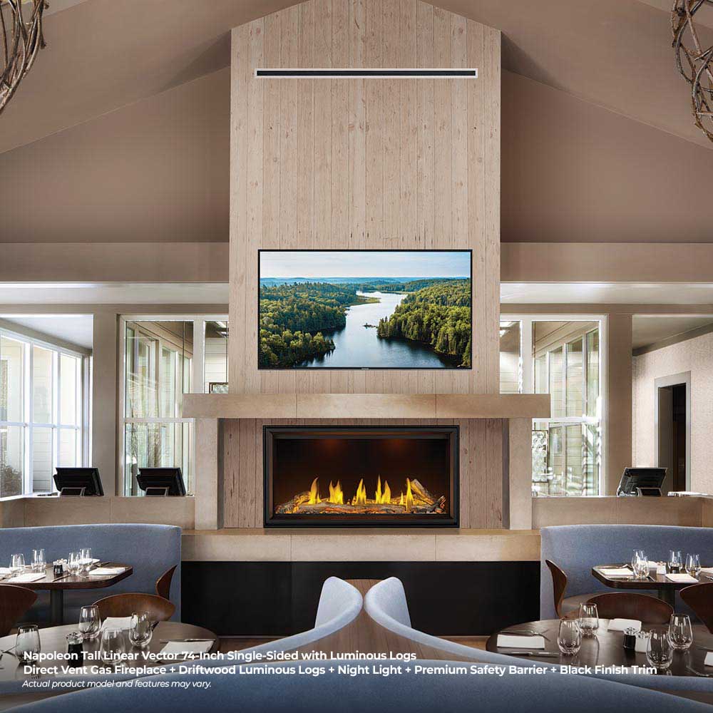 Linear gas fireplace with luminous logs and yellow flames under a stone mantel
