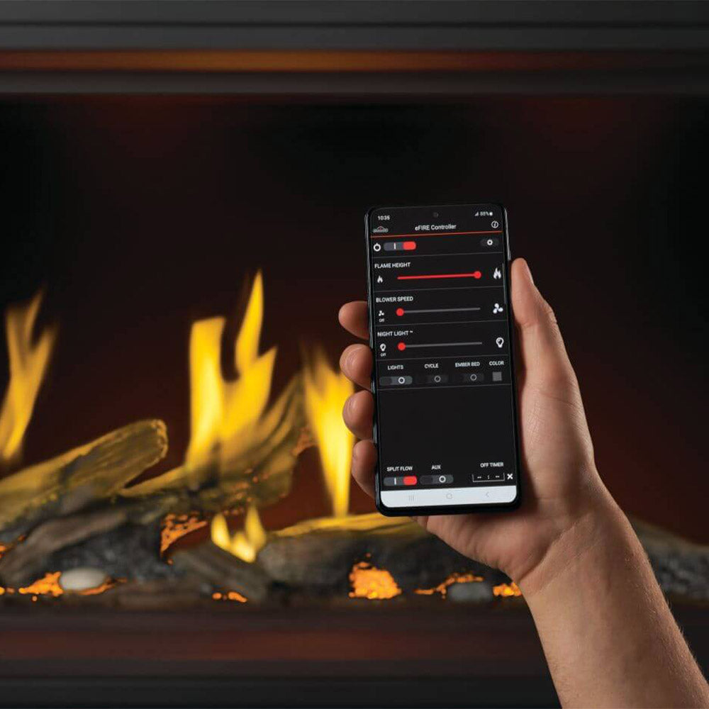 Gas fireplace with smartphone app controller shown in front of luminous logs and flames