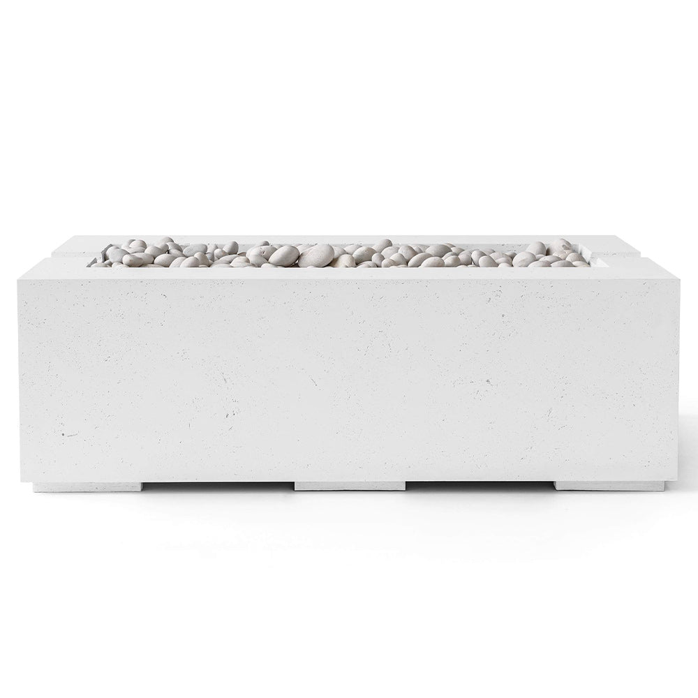 Light-colored concrete gas fire pit with stone fire media, rectangular burner enclosure