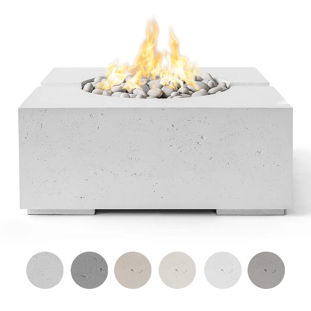 Lightweight concrete gas fire pit with flame and gray river rocks in a square bowl