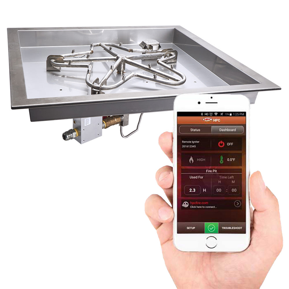 Square burner pan with igniter components; hand holds smartphone showing fire pit control app