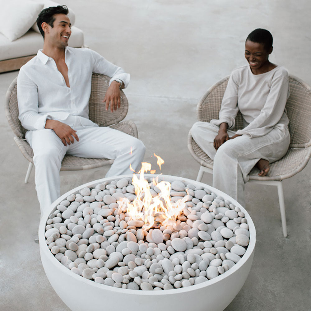 40-inch lightweight concrete gas fire bowl with flames above light gray pebble stones
