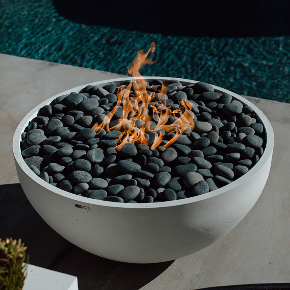 40-inch lightweight concrete gas fire bowl with flames over dark gray pebble stones