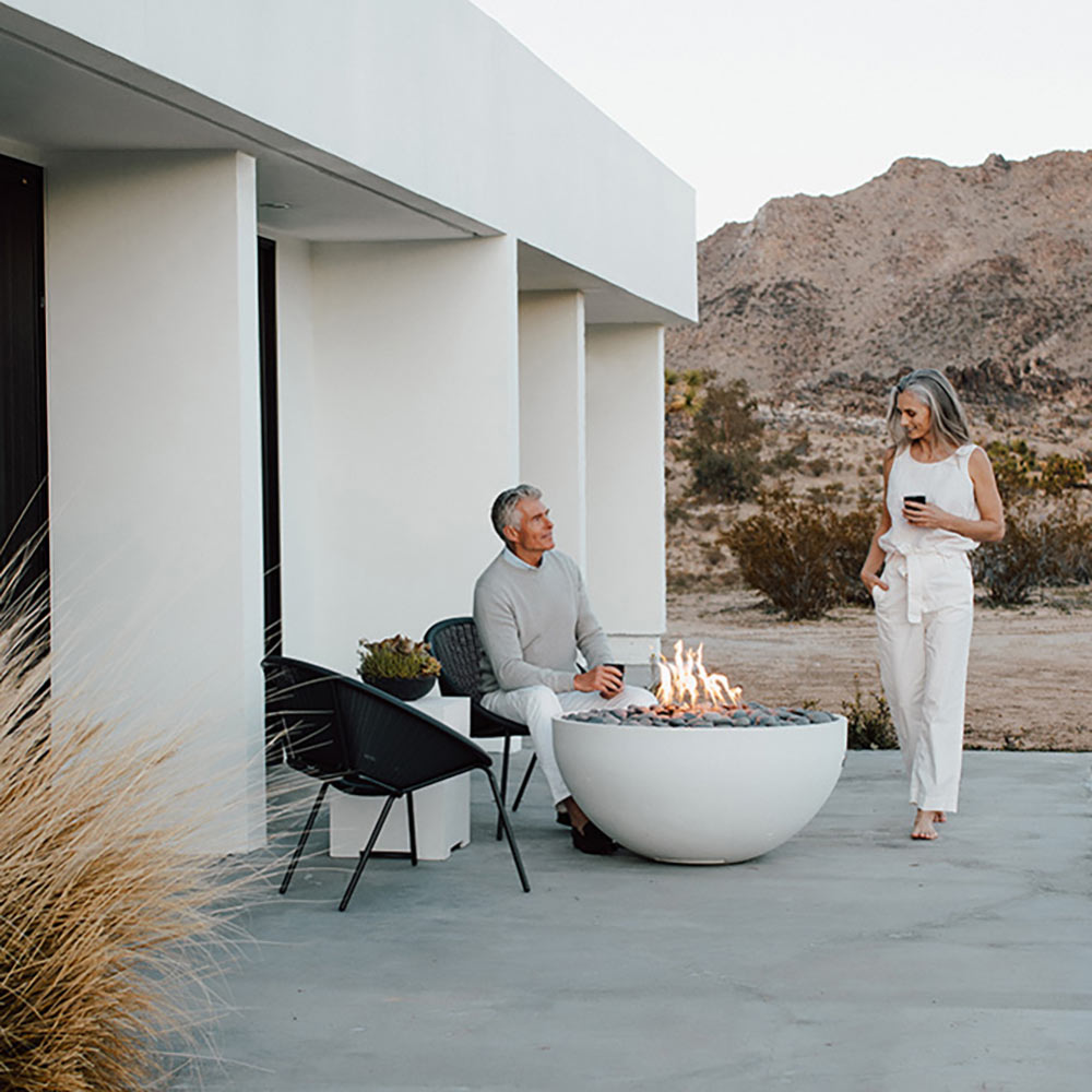 40-inch lightweight concrete gas fire bowl with flames and light gray pebble stones
