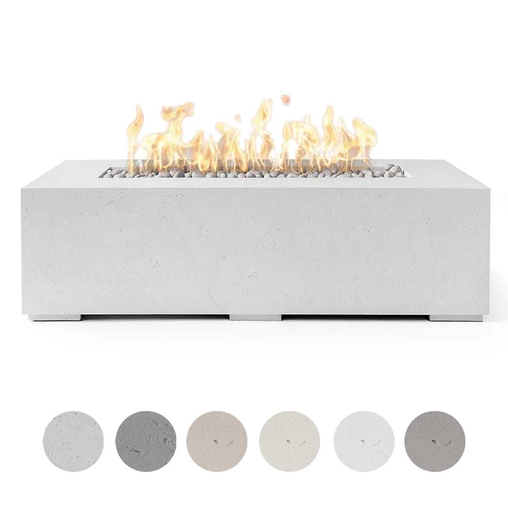 Lightweight concrete gas fire pit with burning flames and smooth gray river stones