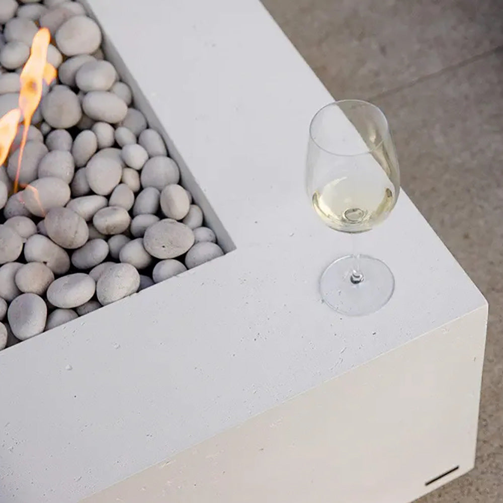 Lightweight concrete gas fire pit corner with gray stones, flame view, and control knob