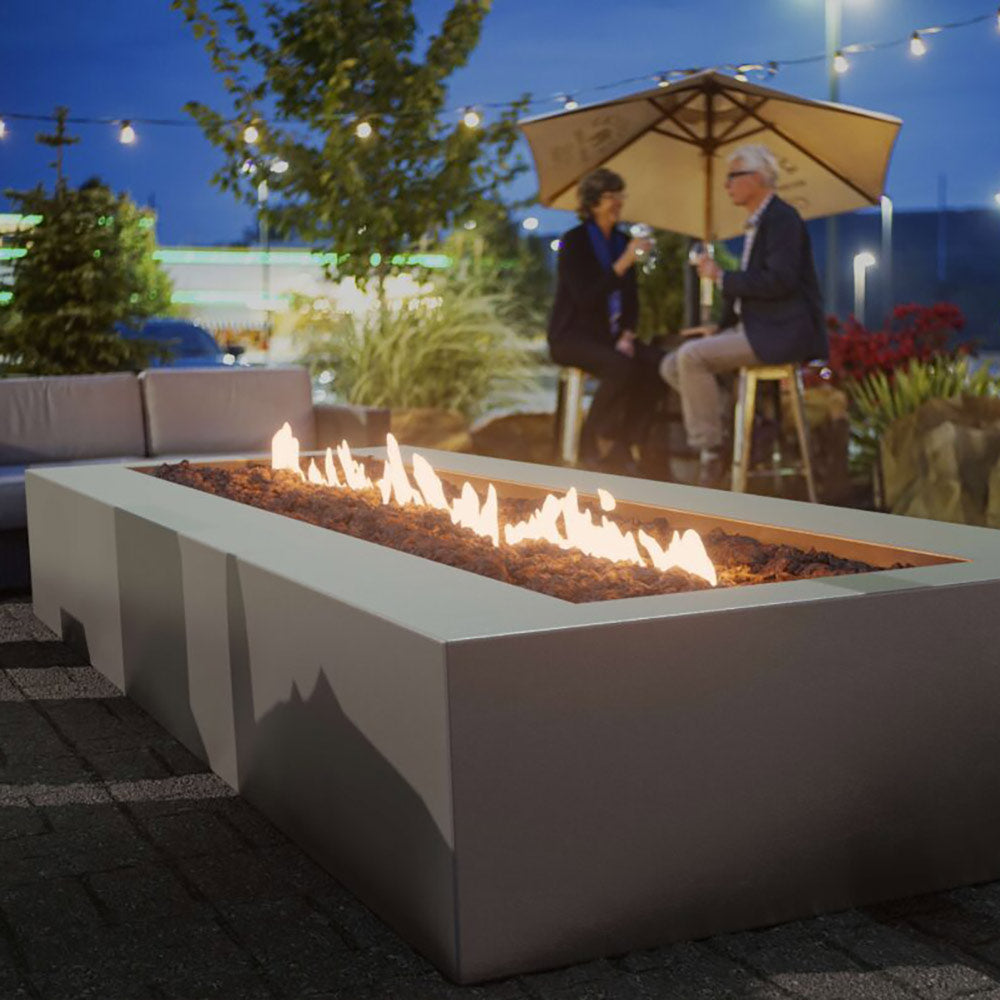 Rectangular metal fire pit with torpedo burner, flames burning in tray