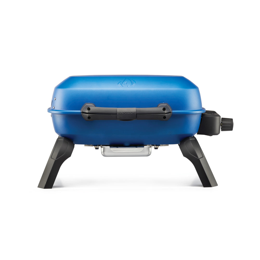 Blue portable tabletop gas grill with black control knob and side handles, closed lid