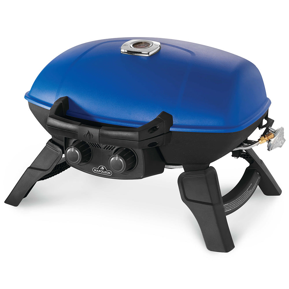 Portable tabletop gas grill with blue lid open, black burners and front control panel