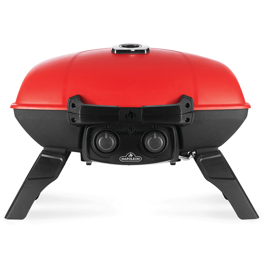 Red portable tabletop gas grill with black front controls and three-legged base