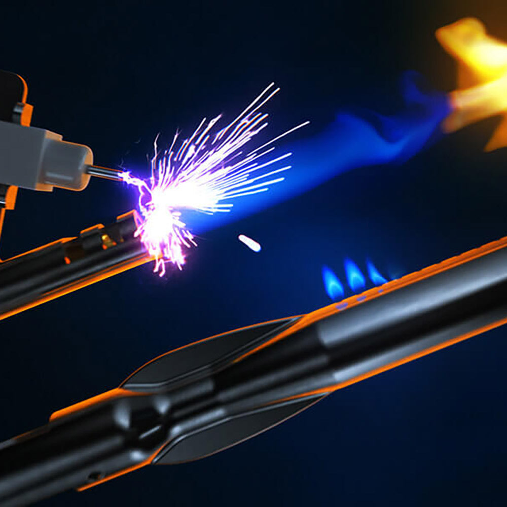 Propane grill burner igniting with visible sparks and blue flames.
