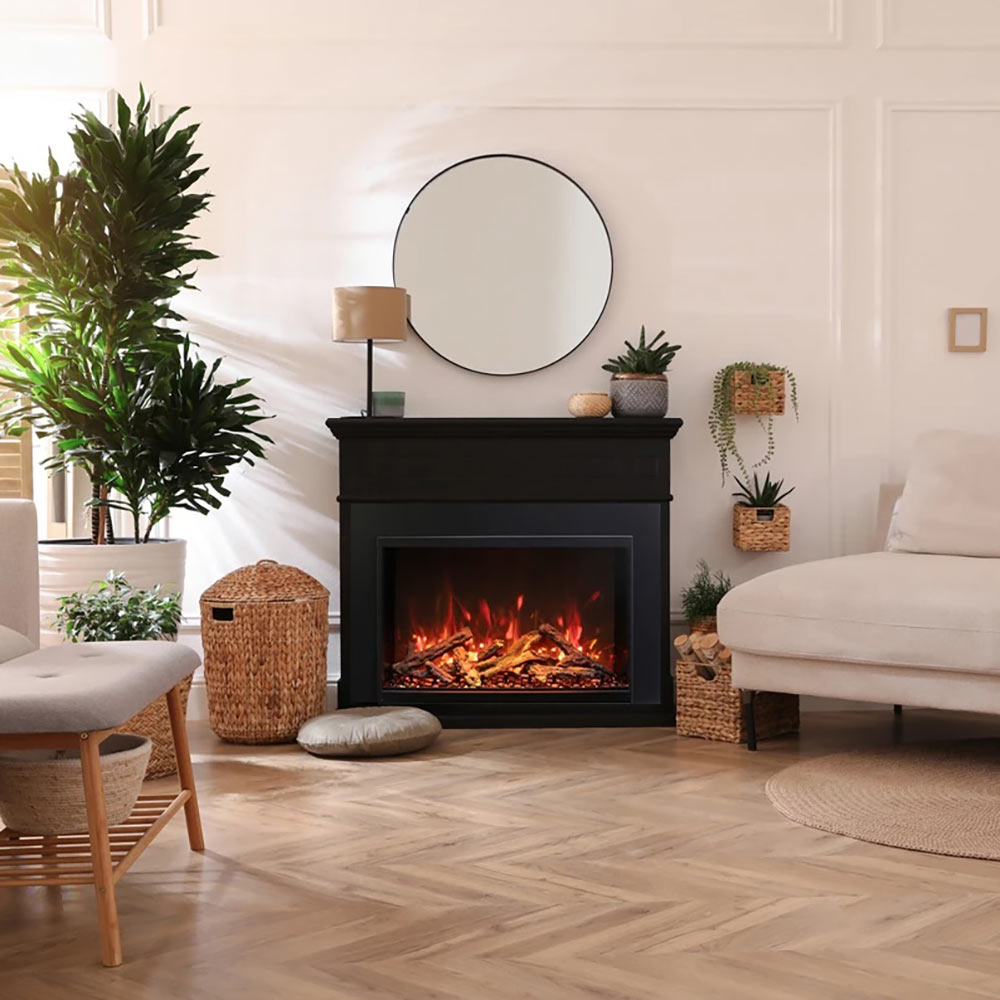 Black electric fireplace insert with glowing logs and orange flames in a front opening