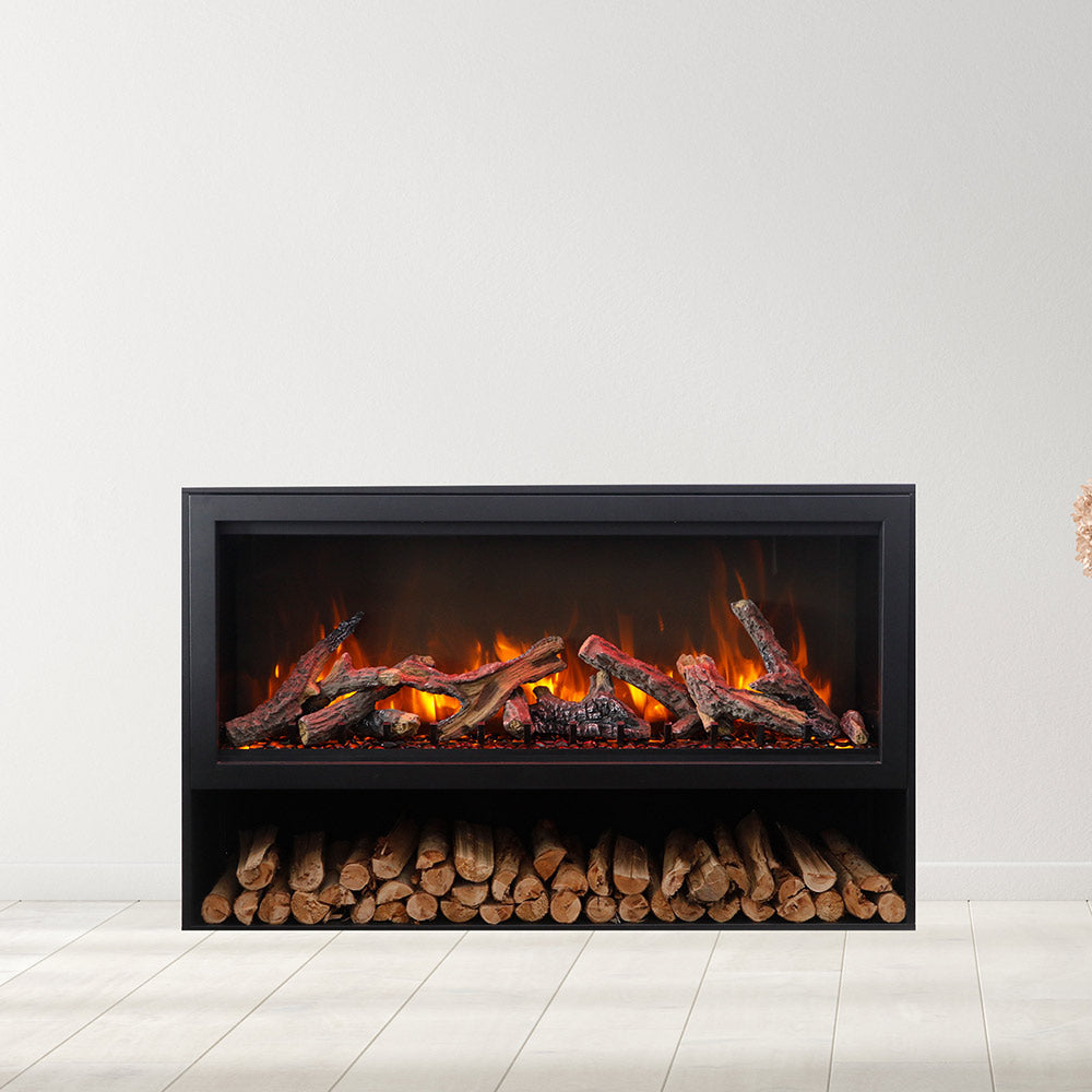 Black built-in electric fireplace with burning logs and front log storage panel