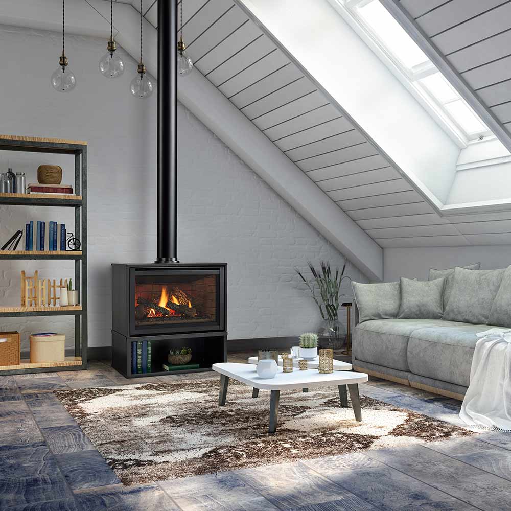 Freestanding gas fireplace on floor with black frame and burning flames in window