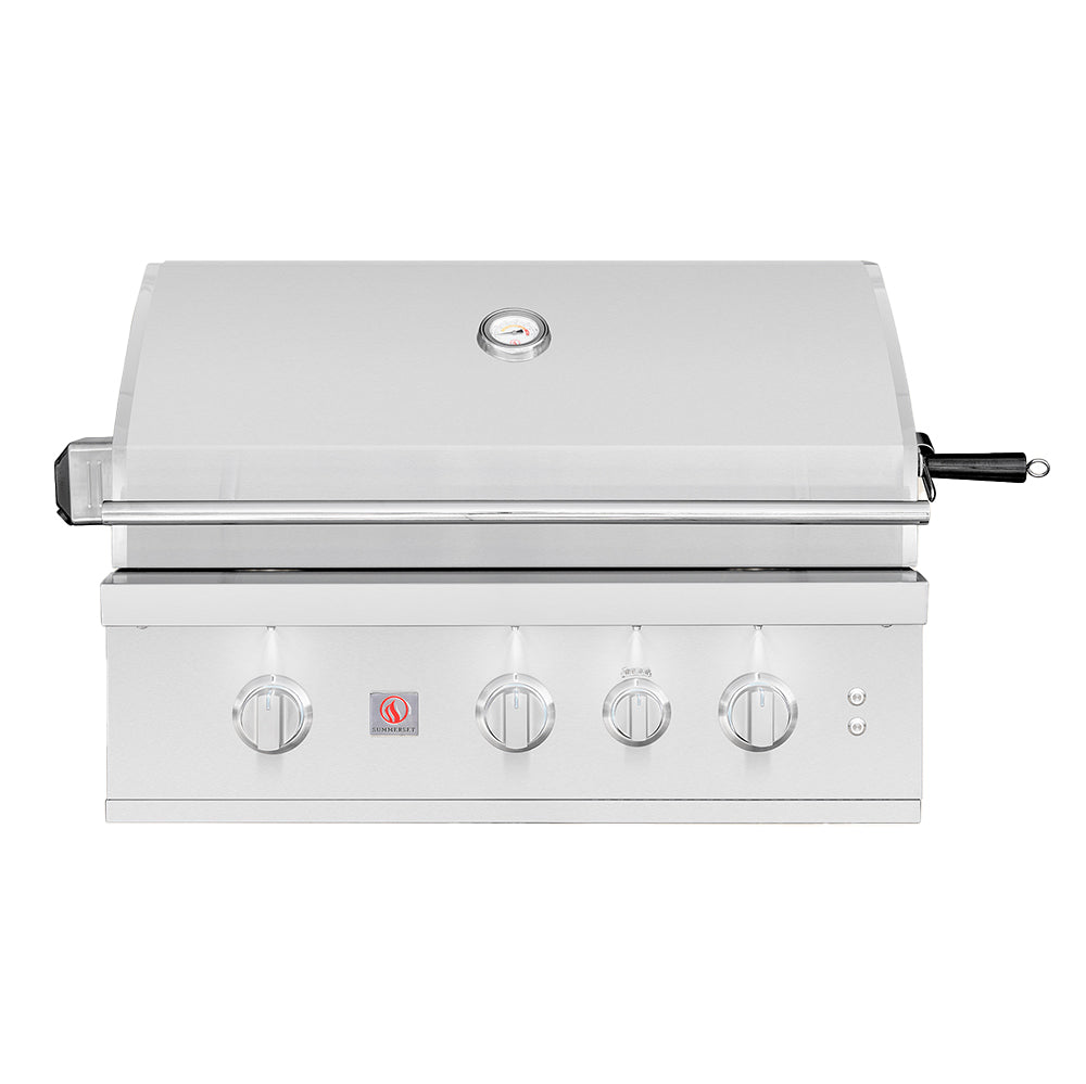 Stainless built-in gas grill with closed hood, four control knobs, and side handle