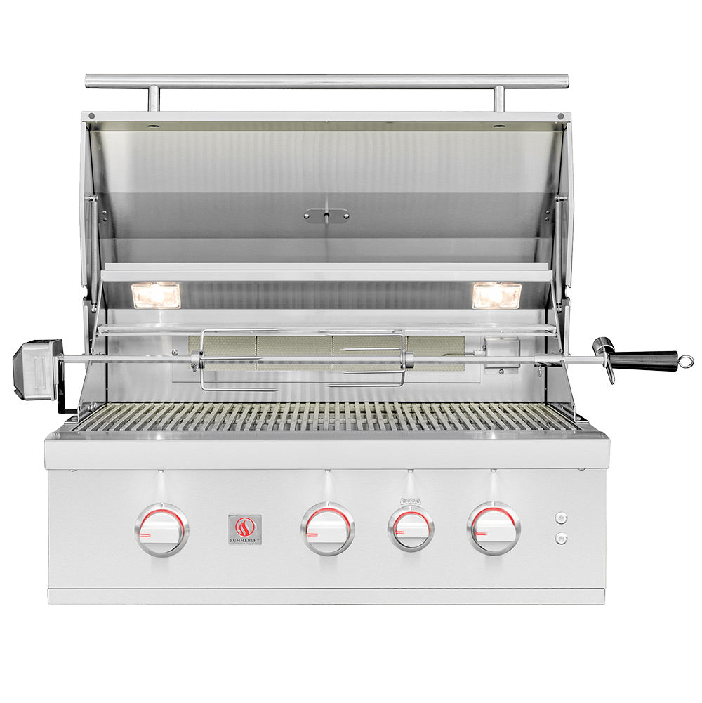 Stainless built-in gas grill with open lid, burner area, and four front control knobs