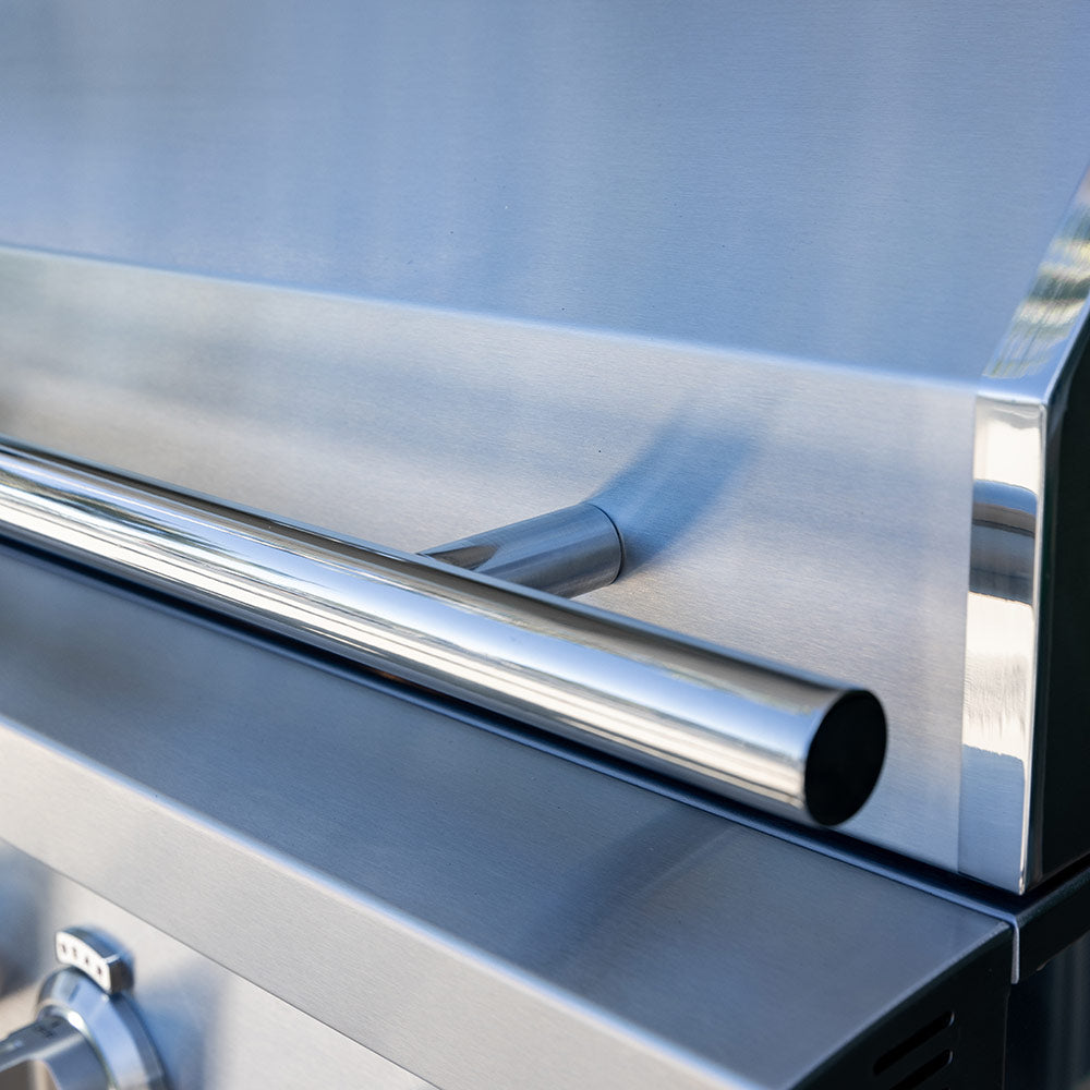 Built-in gas grill vent outlet and stainless side panel, close-up