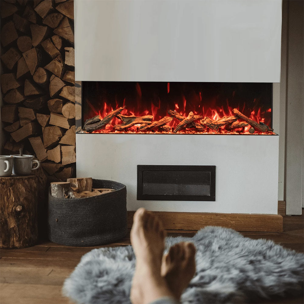 Built-in electric fireplace with glass-front flame bed, black control panel, glowing logs