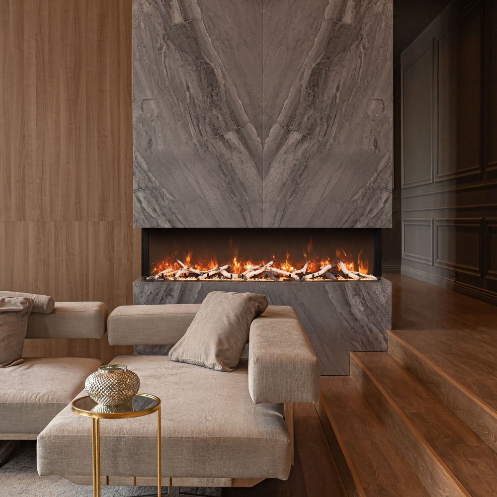 Black electric fireplace set into stone surround with visible flame bed