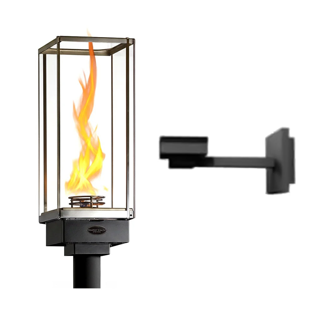Wall-mounted gas torch with clear glass enclosure and flame in metal frame