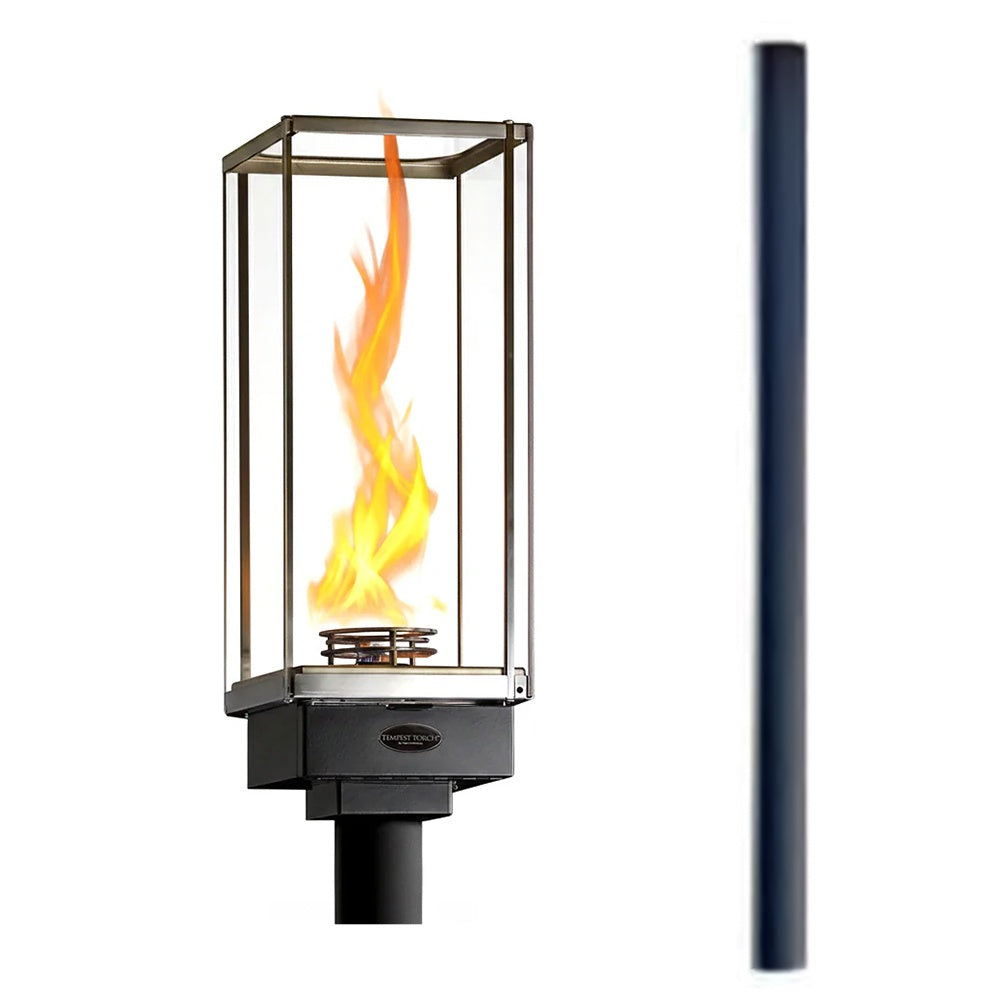 Tempest Torch gas lantern with clear glass and burning orange flame, in-ground mount