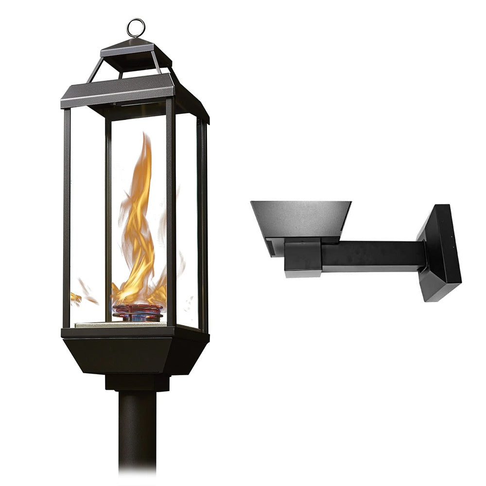 Black gas lantern with glass sides and visible flame, wall-mount bracket