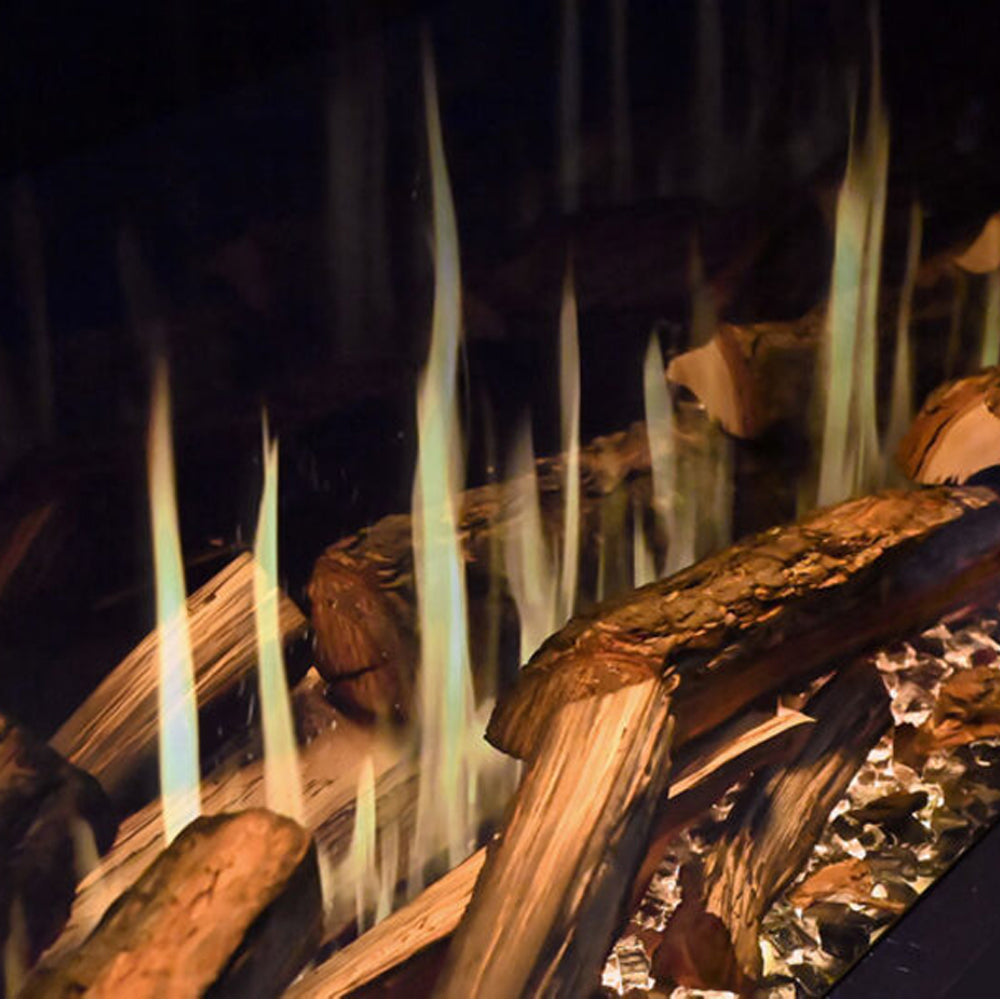 Timber log set fireplace with visible flames burning in an insert