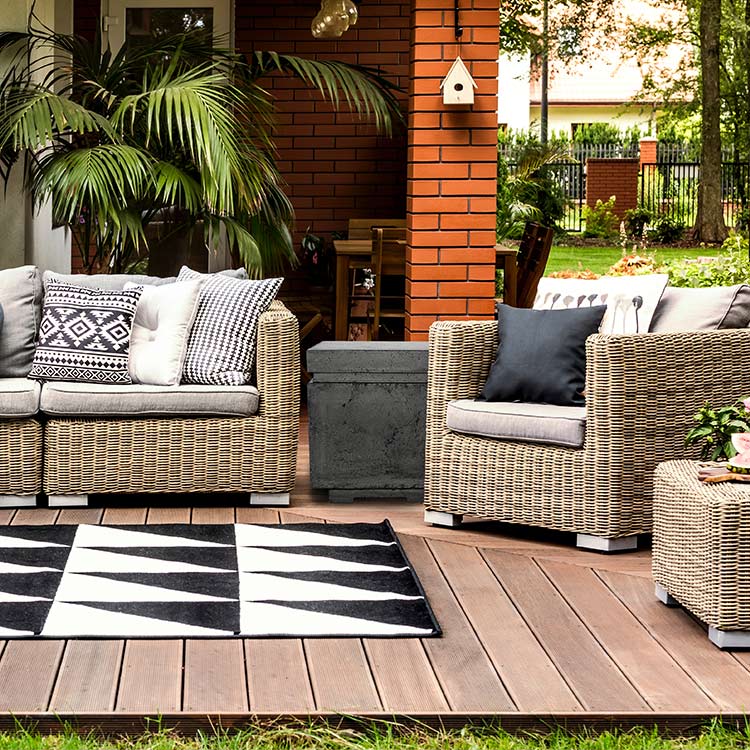 Concrete propane enclosure in gray, square chimney-style outdoor fire feature