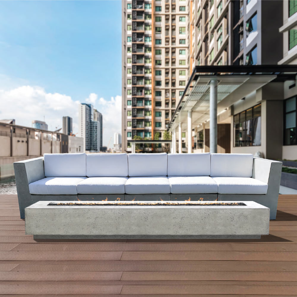 Rectangular concrete gas fire pit with long burner opening on a built-in base