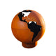 Orange globe gas fire pit with dark continents and metal base