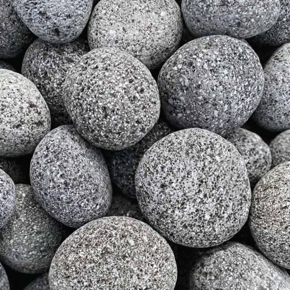Tumbled lava rock stones, round gray with speckled black texture