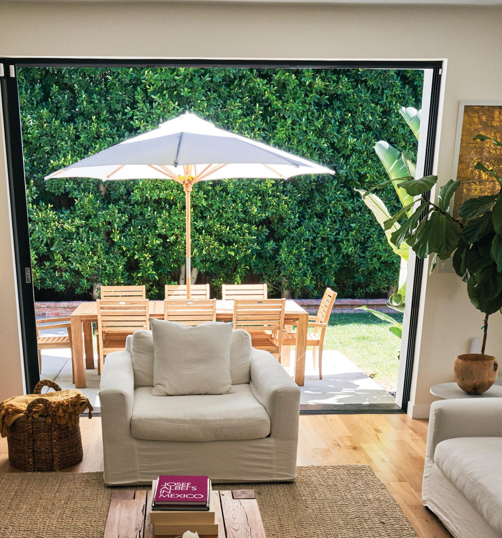 10-foot deluxe patio umbrella with white canopy and wooden frame, open