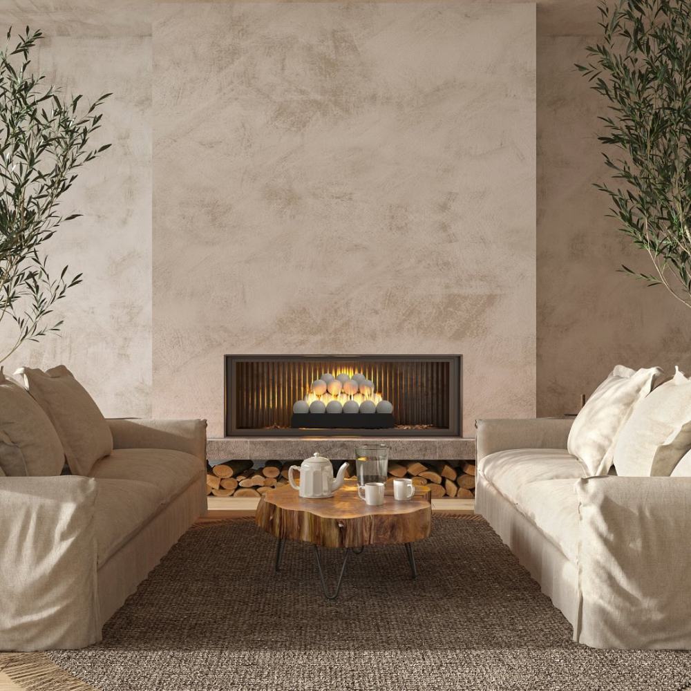 Ventless burner with pale stone fire spheres and orange flames behind a metal grate