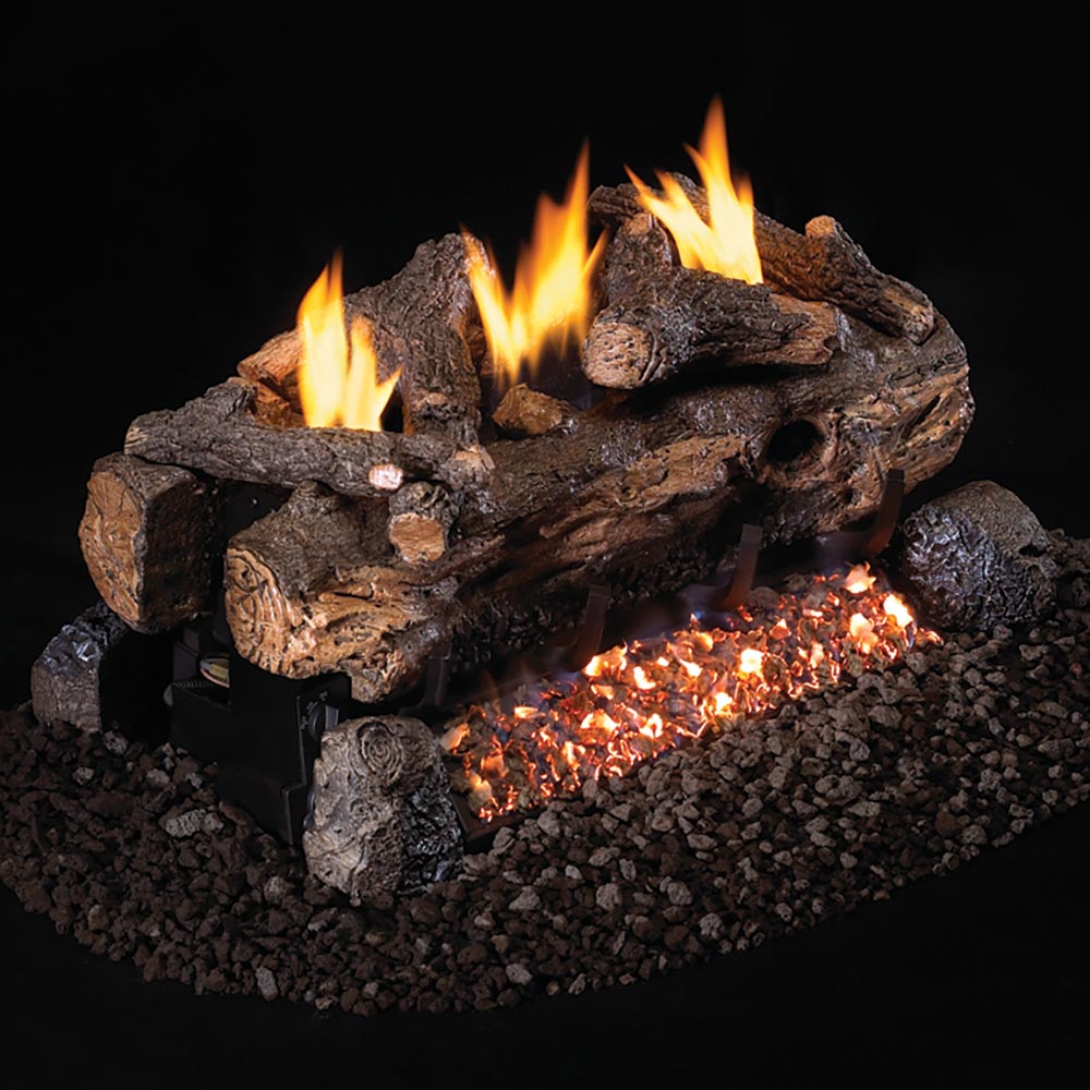 Ventless gas log set with glowing flames and dark charred logs on black lava rock