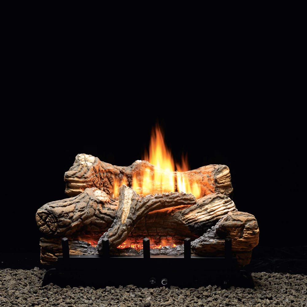 Ventless fireplace burner with millivolt valve, glowing flame over logs