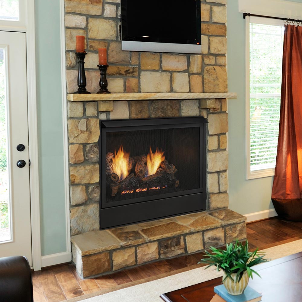Black fireplace insert with burning gas logs inside stone and brick surround
