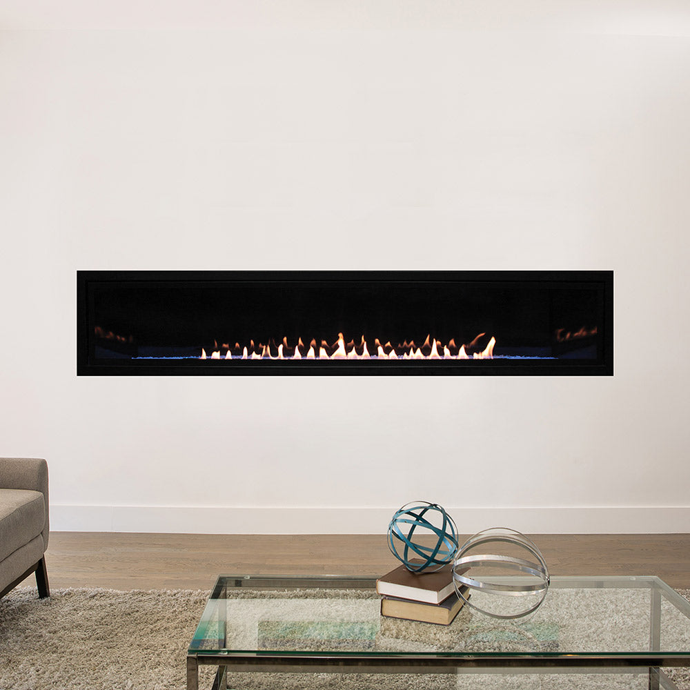 White Mountain Hearth ventless linear fireplace with black frame and glass viewing area, flames visible