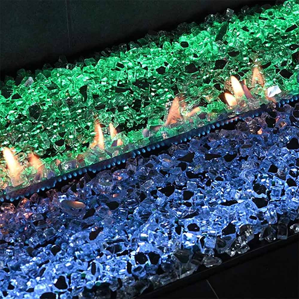 Ventless linear burner with blue and green glass media and small visible flames
