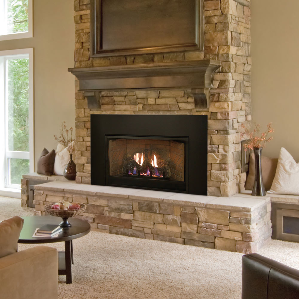 Ventless fireplace insert with black firebox and faux log set, set into stacked stone surround