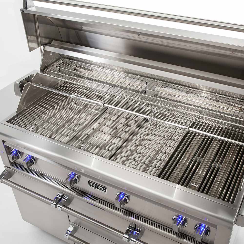 Stainless steel grill with grates lifted, burner rows, and front control knobs