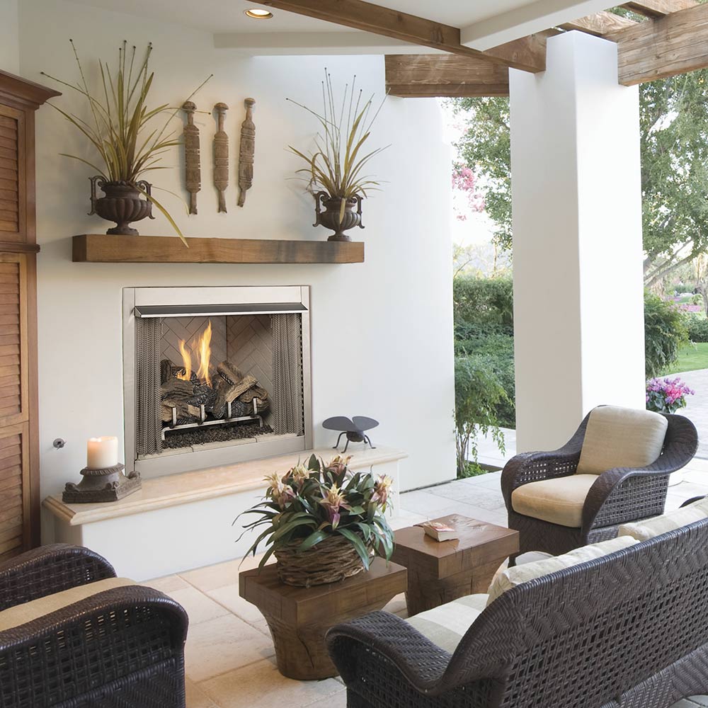 Vent-free outdoor gas fireplace with flame and log set in rectangular metal surround