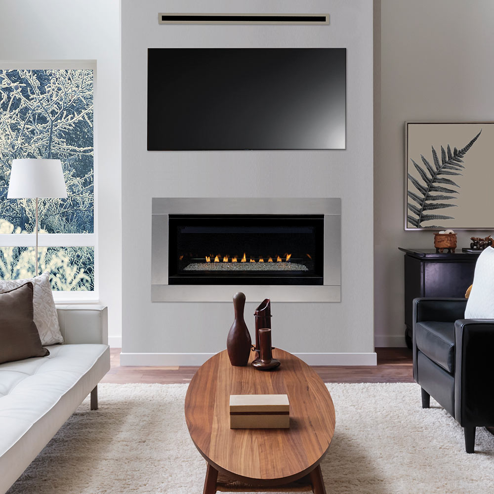 Vent-free gas fireplace insert with black front panel and visible flame bed